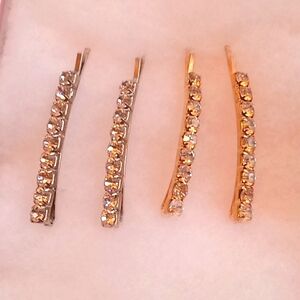 NWOT.  4 RHINESTONE BARS 2 GOLD & 2 SILVER SETTINGS HAIR PINS (1" LONG).